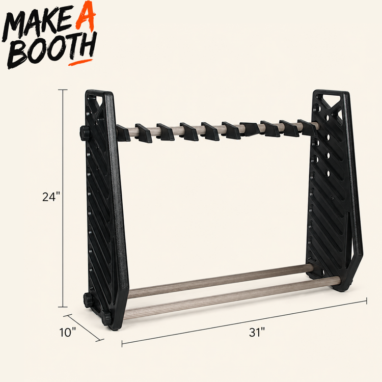 Black gun rack with staggered holders and silver rails, measured 31 in wide.
