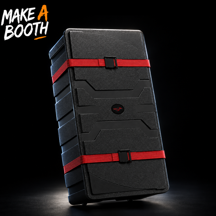 Hard shipping case with foam lining, black shell, red straps, and latch buckle.