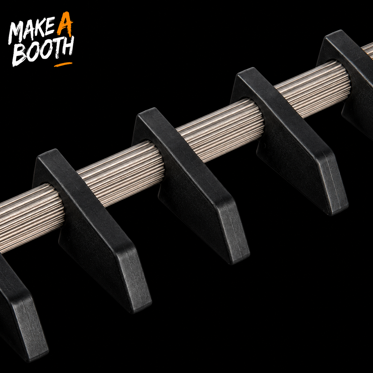 Close-up of black gun rack holders with ridged silver rails.