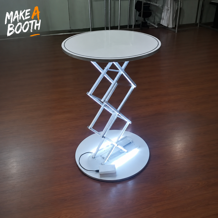 LED-lit tension counter with round white top, silver frame, and lit base