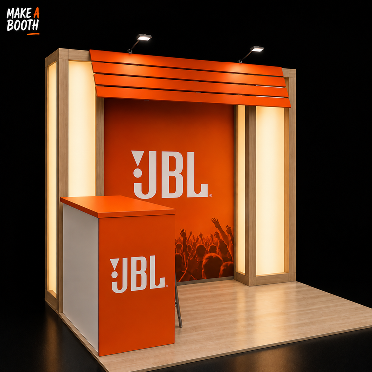 Orange and white exhibit booth with front counter and overhead light on wood platform